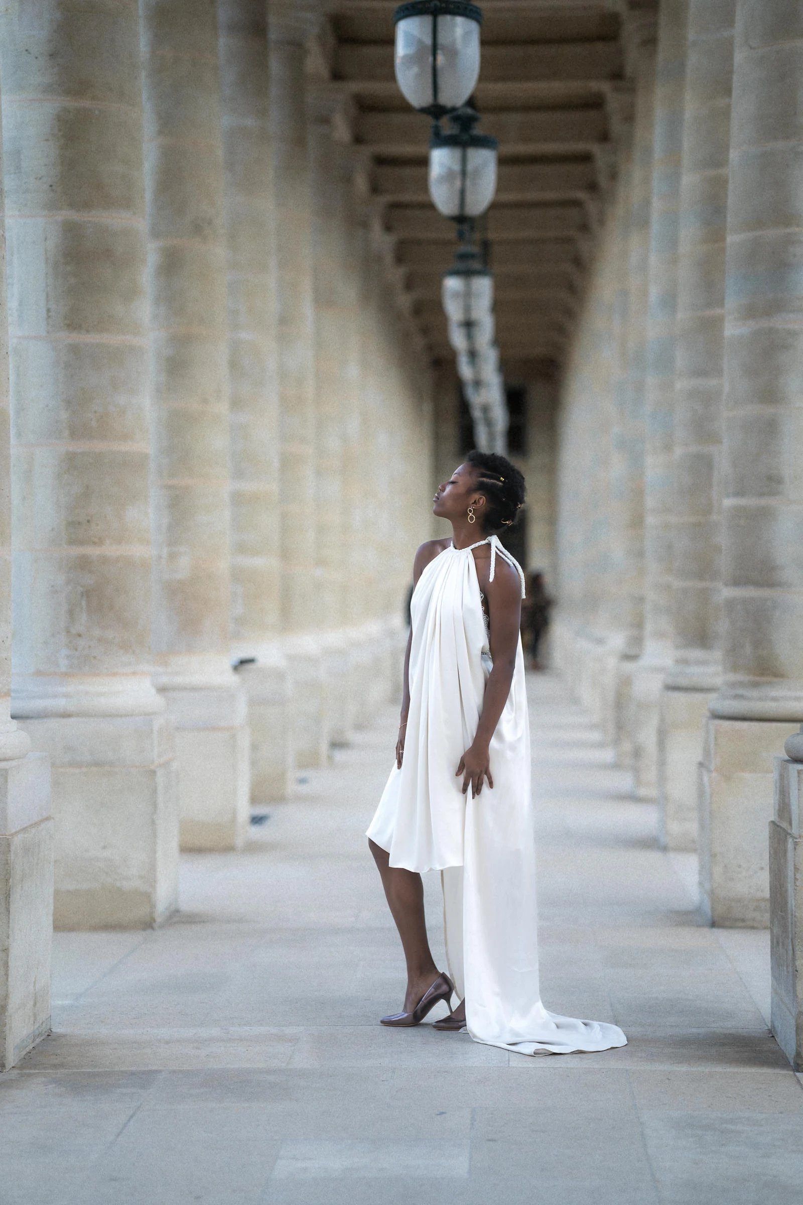 The bride in profile in the gallery of the Palais-Royal, Paris