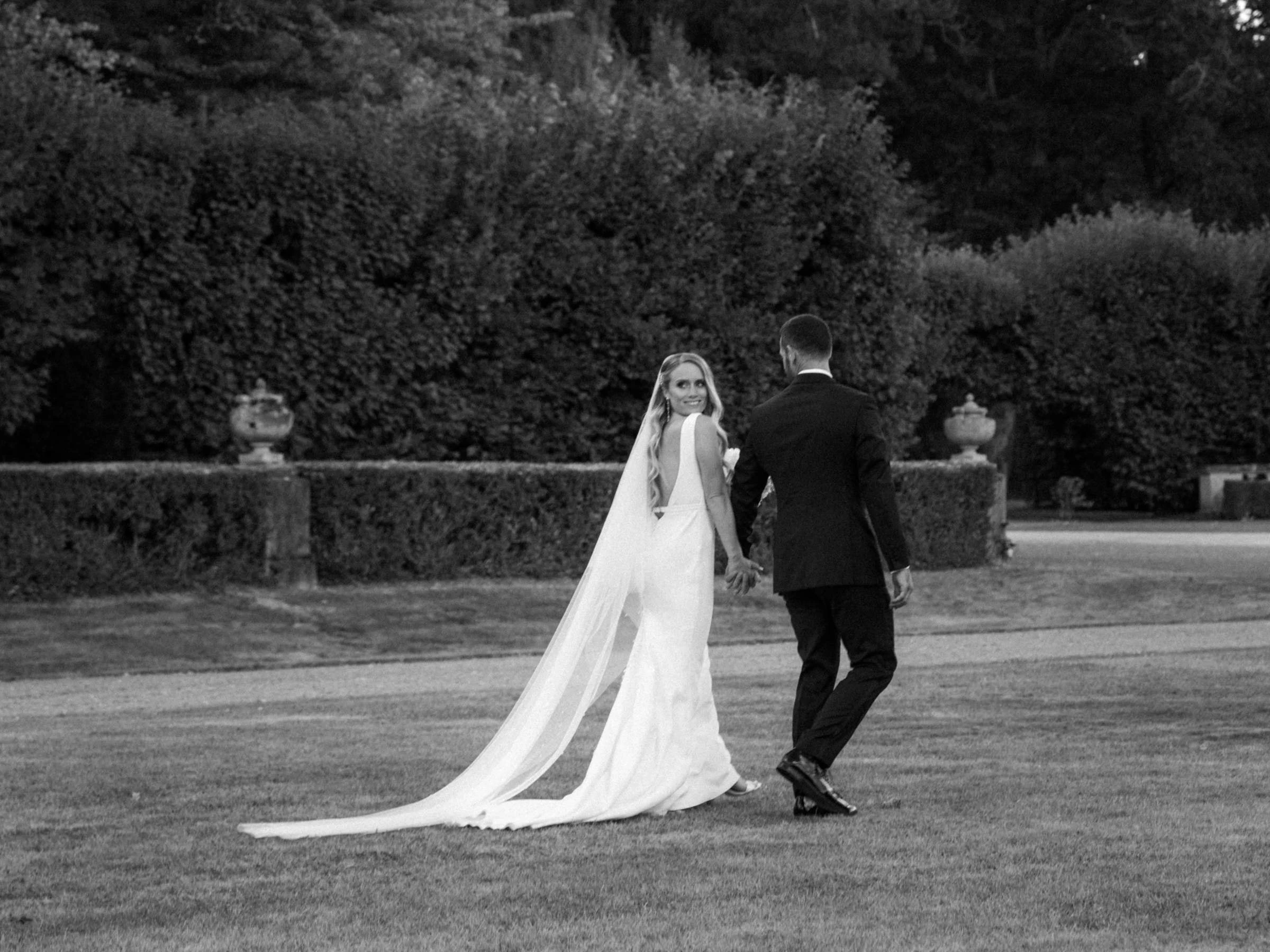 The couple in the formal French garden, black and white, château du Pont-Chevron